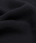 Close-up of the Cameron Crewneck in black, highlighting its knitted texture and soft, wavy folds—a lightweight sweater designed for comfort and a cozy feel.