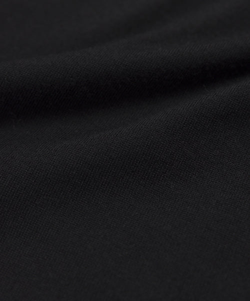 Close-up of soft black fabric with gentle folds and smooth texture—ideal for creating the Grayson Pullover or your favorite lightweight sweater.