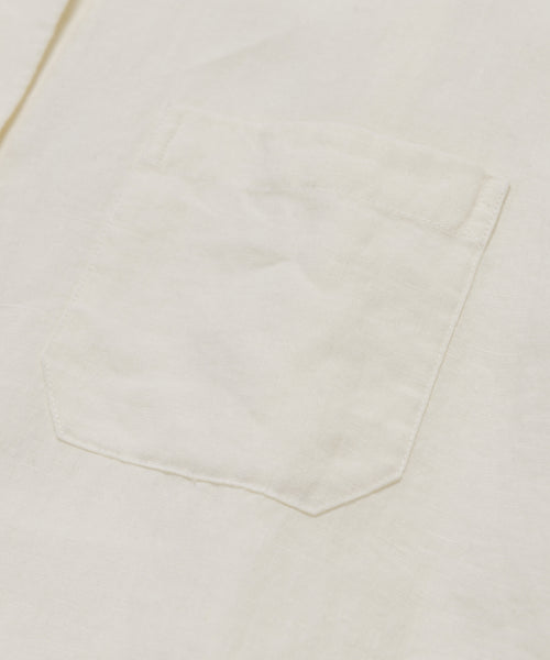 Close-up of the Linen Logan Shirt’s white pocket, showcasing stitching and texture details that define this boxy-fit button-up’s effortless style.