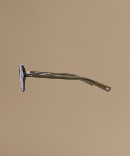 Sunglasses against a beige background.