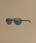 Sunglasses against a beige background.