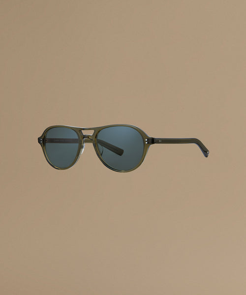 Sunglasses against a beige background.