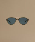 Sunglasses against a beige background.