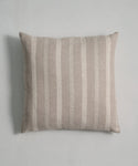 Handwoven from linen, the Laurel Pillow features light beige and off-white vertical stripes. Its soft, textured fabric adds a minimalist touch, making it a versatile, neutral accent for any space.