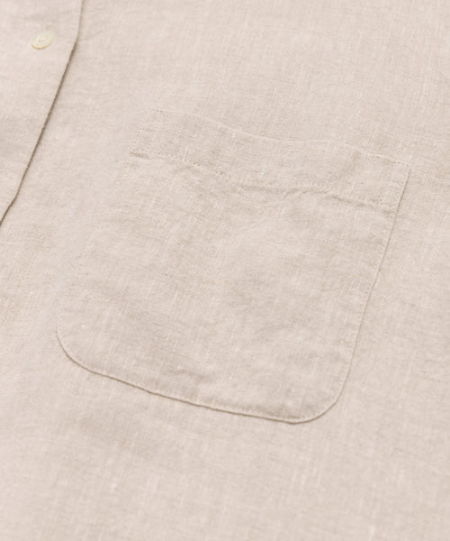 Close-up of the Linen Colby Shirt in beige, featuring its breast pocket and button placket, and highlighting the summer shirts textured linen fabric and detailed stitching.