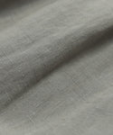Close-up of the Linen Logan Shorts light gray linen fabric, showcasing its textured weave, gentle folds, and soft, natural surface—slightly wrinkled for relaxed, warm-weather style.