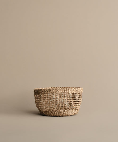 The Seagrass Produce Bowl adds a stylish touch to your kitchen while keeping fruits and vegetables organized on any surface.