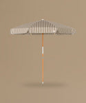 Stripe Beach Umbrella against a beige background