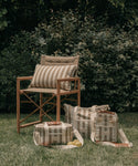 Beach bag with stripes with a grass background