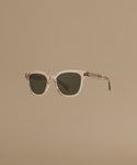 Sunglasses with a transparent frame on a beige background