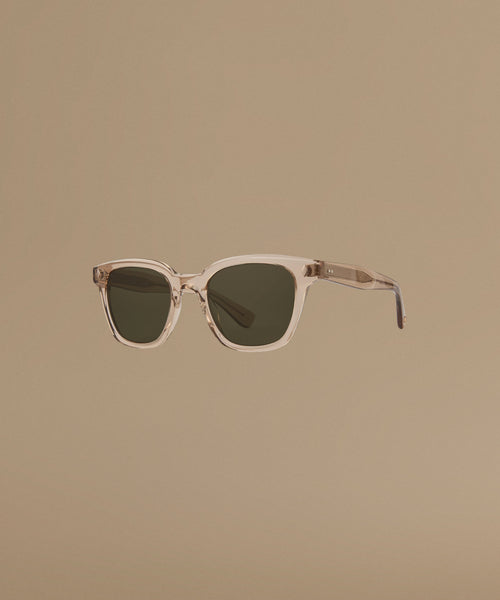 Sunglasses with a transparent frame on a beige background