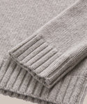Close-up of the cuffs and hem of the Cashmere Amelia Crewneck, highlighting the ribbed texture and soft grey cashmere material.