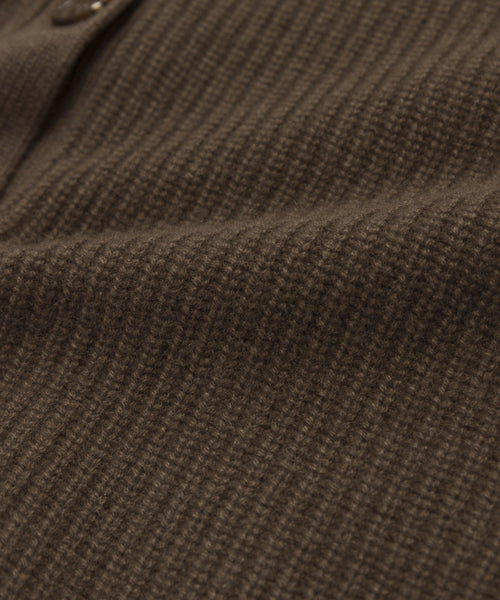 Close-up of the Cashmere Cocoon Cardigan’s lightweight cashmere fabric with a subtle checkered pattern, visible seam, and a button near the top left—perfect details for this oversized cardigan.