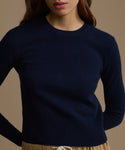 Navy blue Cashmere Leni Crewneck worn by a person on a beige background