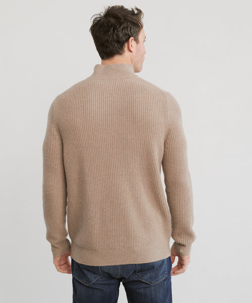 A man wearing the Mens Wool Half Zip in beige and dark blue jeans stands with his back to the camera against a plain light background.