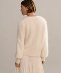 In-studio back shot of cashmere brushed v-neck cardigan with puff sleeve. .