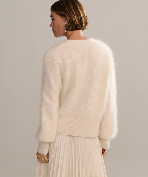 In-studio back shot of cashmere brushed v-neck cardigan with puff sleeve. .