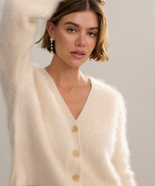 In-studio front shot of cashmere brushed v-neck cardigan with puff sleeve. 