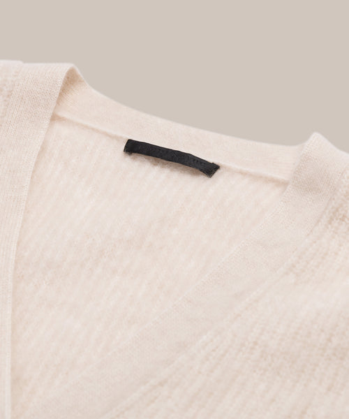 Close-up shot of cashmere brushed v-neck cardigan.