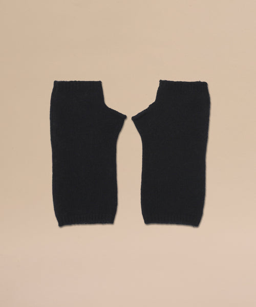 A pair of Fingerless Cashmere Gloves in black with thumb holes, displayed flat side by side on a beige background.