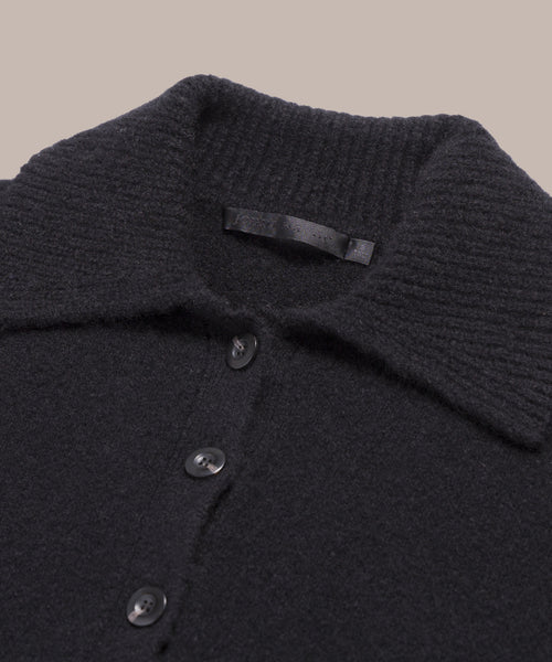 Relaxed knit polo with ribbed collar and three buttons.