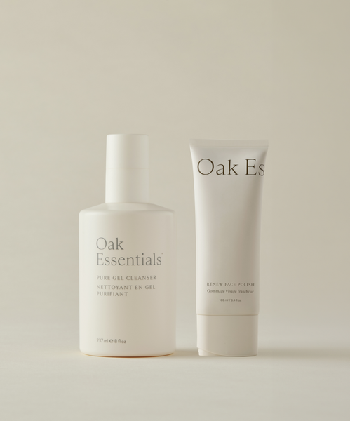 The Cleanse and Polish Duo from Oak Essentials, featuring a white Pure Gel Cleanser pump bottle and Renew Face Polish tube, sits on a neutral background—minimalist design meeting fresh-faced glow.