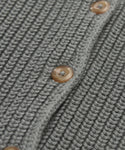 Close-up of the Cotton Hayes Crewneck Cardigan in gray, showcasing its ribbed cotton texture and three brown round buttons along the seam.
