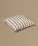 Striped pillow on a beige background