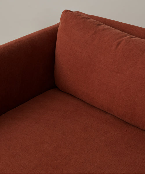 Close-up of the Fabric Swatch Farmhouse Red Linen, highlighting its rich color and textured upholstery material.