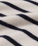 Close-up of the Grace Crewneck, featuring luxury knit fabric with horizontal navy blue and white stripes that highlight its rich texture and classic pattern.