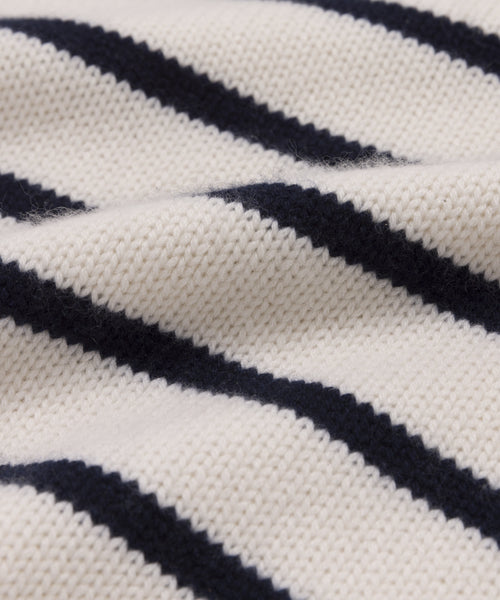 Close-up of the Grace Crewneck, featuring luxury knit fabric with horizontal navy blue and white stripes that highlight its rich texture and classic pattern.