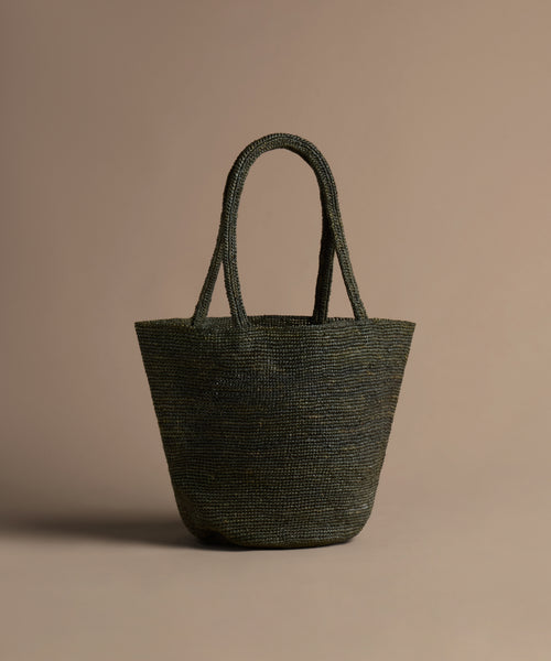 Olive handbag on a beige background
