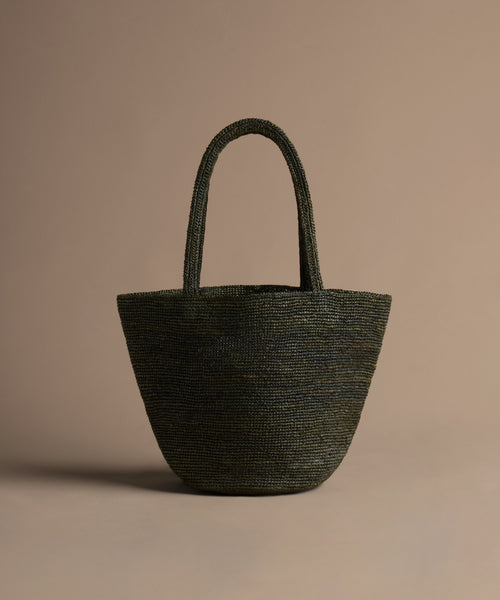 Olive handbag on a beige background