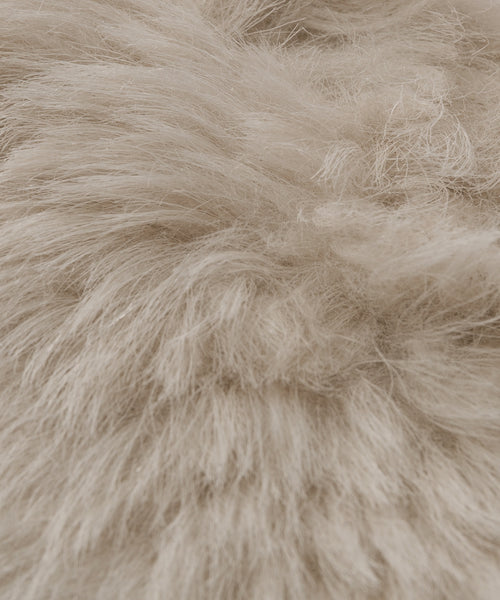 Close-up of Fabric Swatch Light Taupe Shearling, featuring soft, fluffy, long wavy strands for a textured and cozy look similar to Icelandic sheep shearling found in Jenni Kayne Furniture.