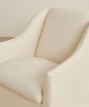 A close-up view of the Miramar Chair Slipcover in cream, featuring soft, rounded edges and a smooth pearl linen texture.