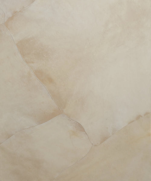 A close-up of beige, subtly textured stone with natural veins and color variations, echoing the refined finish of the Napa Dresser.