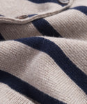 Close-up of the Cooper Cardigan, featuring soft knit fabric in taupe and navy stripes, two brown buttons at the top, and a subtly structured silhouette.
