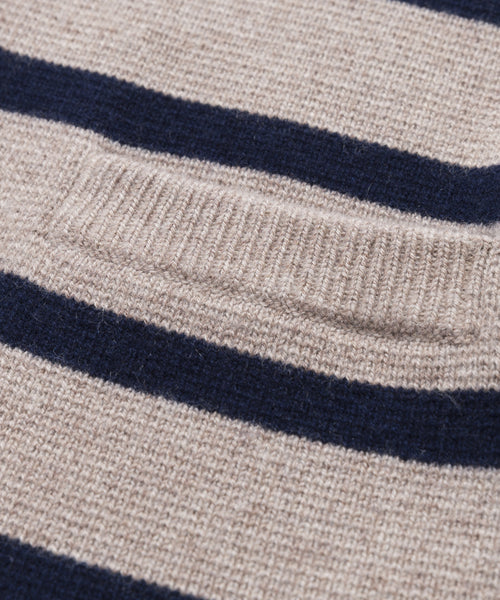 Close-up of the Cooper Cardigan, showing its structured silhouette, textured knit fabric, horizontal taupe and navy stripes, and a small rectangular pocket on the beige section.