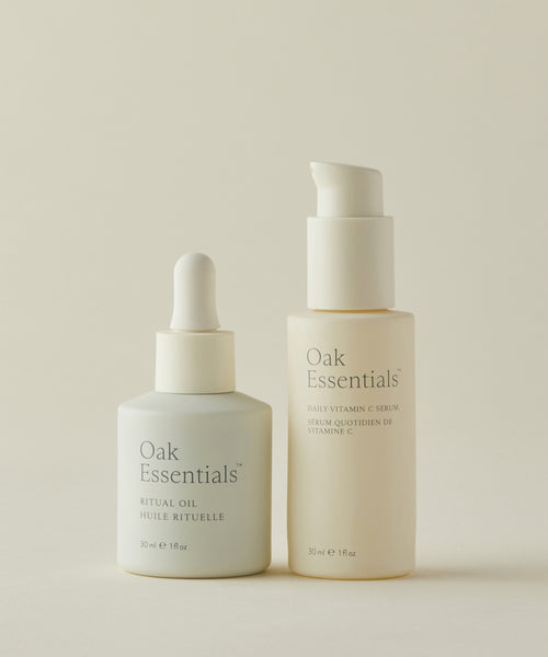 The Brightening Duo from Oak Essentials—30 ml Ritual Oil and Daily Vitamin C Serum—stand side by side on a neutral background.
