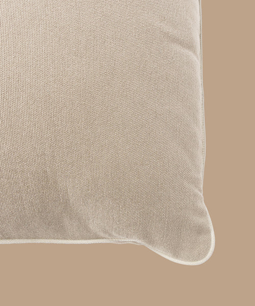Close-up of the Outdoor Vista Lounge Cushion in beige, featuring premium Italian fabric with visible texture and rounded piping, set against a matching beige background.