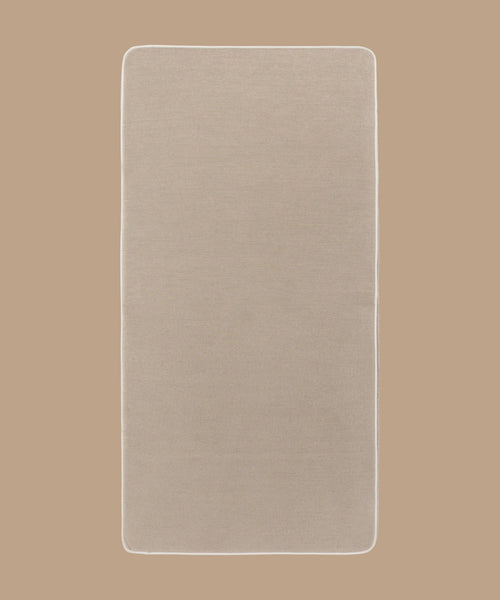 A beige Outdoor Vista Sofa Cushion with rounded corners is shown on a matching beige background. The cushion appears plain, with no visible patterns or textures.