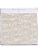 A square Fabric Swatch Performance Ivory displays a woven texture in creamy ivory, visible edge stitching, and a white paper label—ideal for use with the Outdoor Brentwood Ottoman.