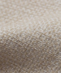 Close-up of the Fabric Swatch Performance Ivory showcases its textured weave and detailed fibers—an ideal choice for enhancing outdoor furniture pieces.