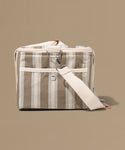 Striped fabric bag with a strap on a beige background