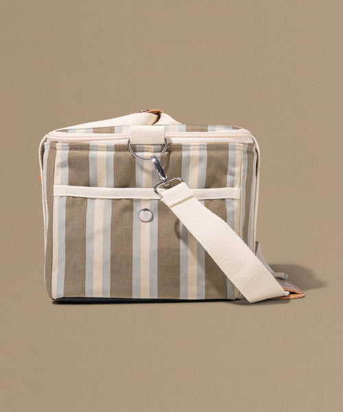 Striped fabric bag with a strap on a beige background