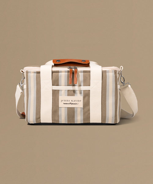 Striped bag with a visible brand label on a beige background