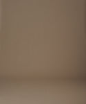Thumbnail for video: Woman wearing a green cable knit sweater and a white skirt on a beige background