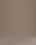 Thumbnail for video: Woman wearing a gray sweater against a beige background