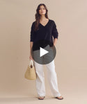 Thumbnail for video: Model wearing Simone V-Neck in Black.