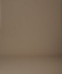 Thumbnail for video: Woman wearing a beige knit cardigan standing against a beige wall.